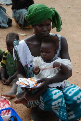 A mother and child take part in the International Lipid-Based Nutrient Supplements trial in Burkina Faso. (Sonja Hess)