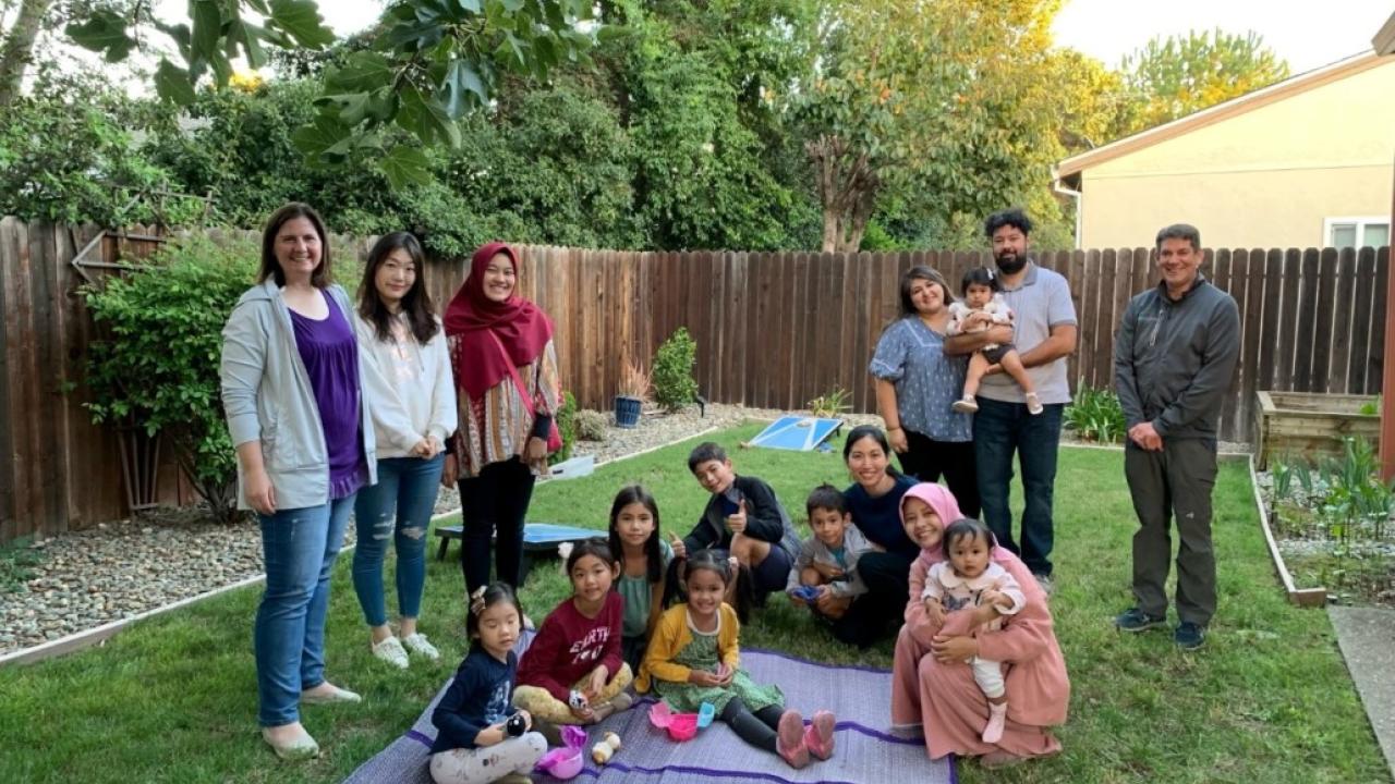 Trellis lab members standing around families