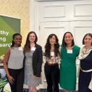 Group photo of Drs. Lauren Au, Drs. Cassandra Nguyen, and grad students